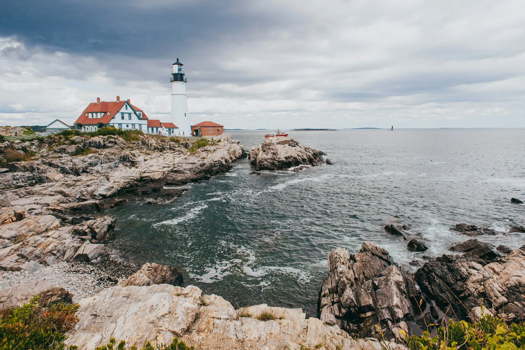 Portland Head Light on a rocky cliff above the ocean, Maine